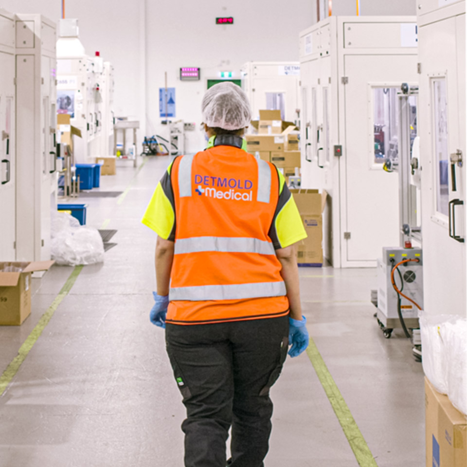 Image of a Detmold Medical employee walking through the medical grade manufacturing facility