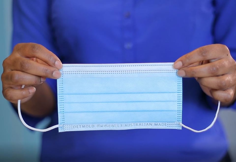 Image of a person holding a Detmold Medical L3 Surgical Mask