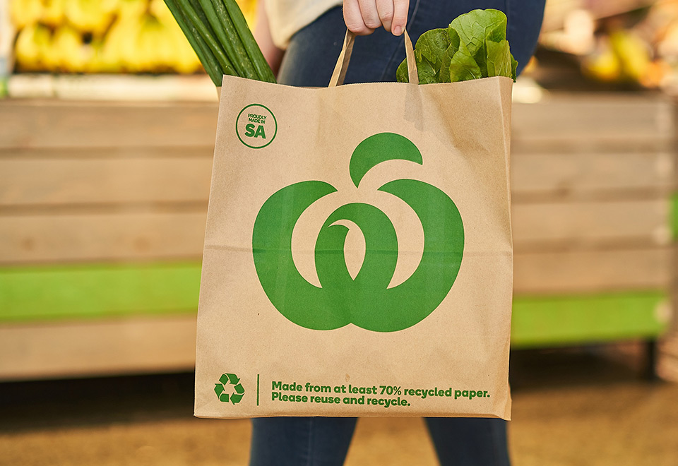 Image of Woolworths bag in use at a supermarket