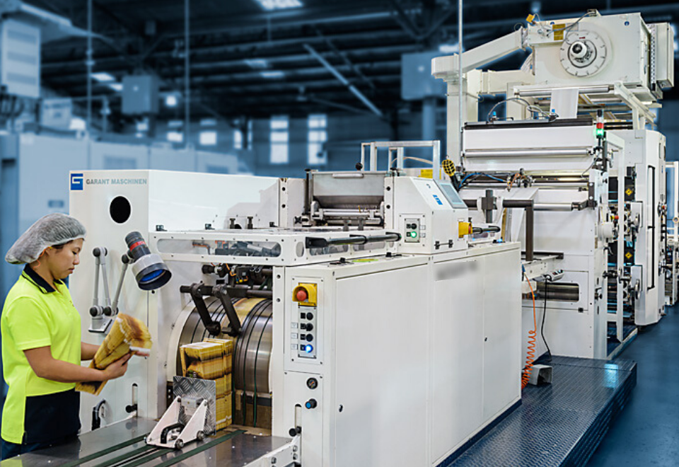 Image of woman at Detmold Group machine