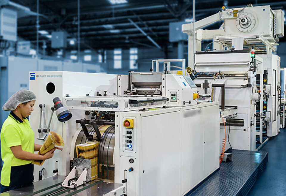 Image of woman at machine at the Detmold Group